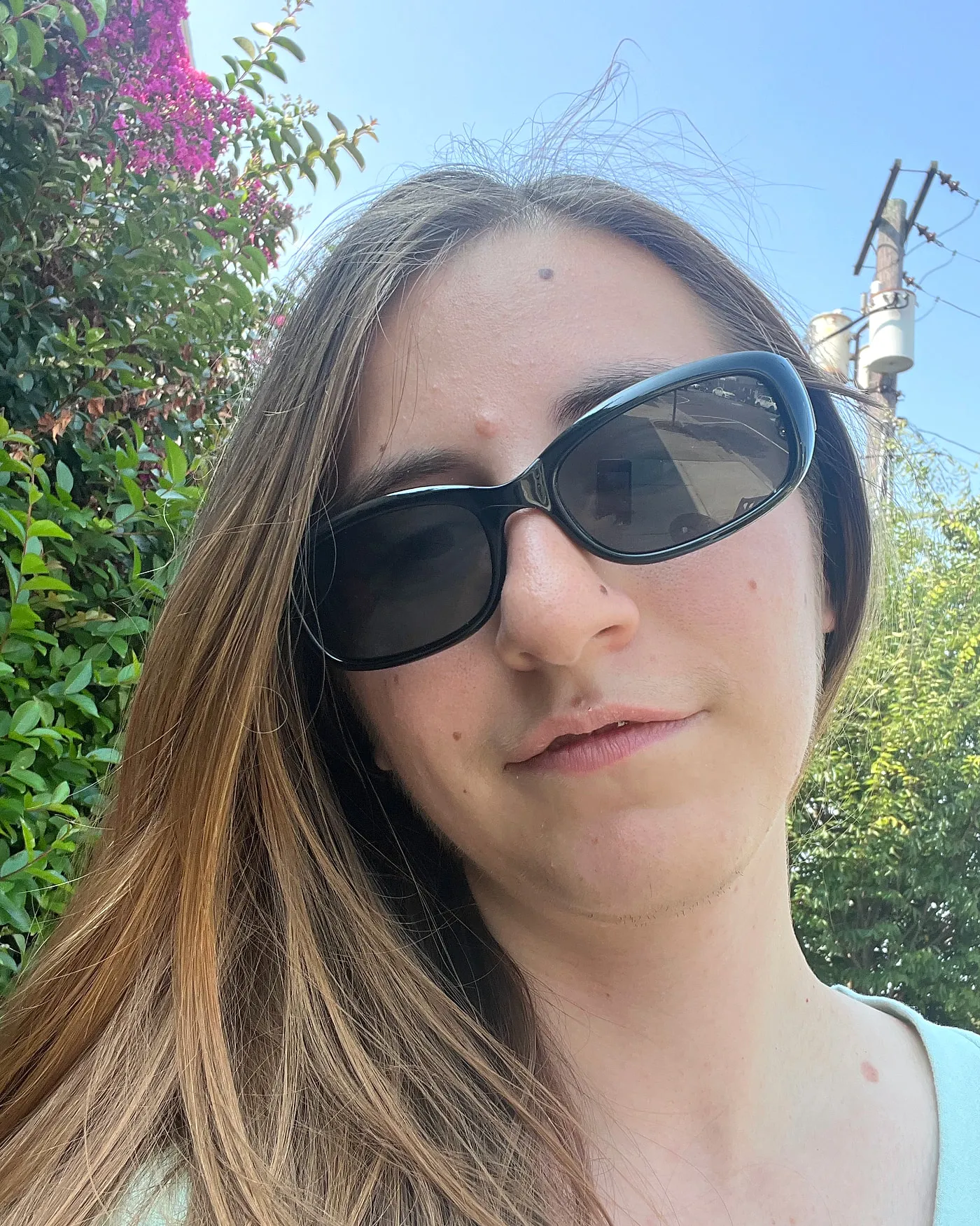Lillian Riggs in sunglasses on a bright summer day